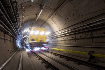 Railway line maintenance vehicle during the work in a subway tunnel. 