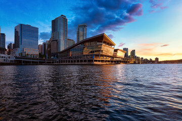 Naklejka premium Modern City Architecture in Coal Harbour, Downtown Vancouver, British Columbia, Canada. Cityscape Skyline. Dramatic Sunset Sky Artistic Render
