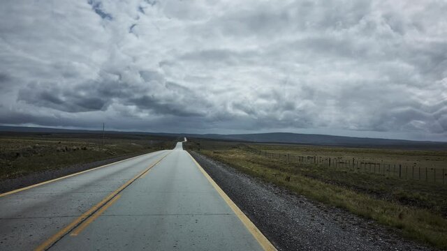 Rural Highway with Overcast Sky and Lighting in Vanishing Point