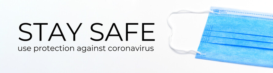 Warning sign saying "STAY SAFE - use protection against coronavirus" with a breathing mask and white background