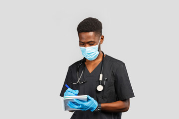 happy african or afro american doctor in medical mask with stethoscope and blue gloves standing against gray background
