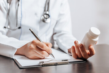 Doctor Writing Medical Pill Prescription for Patient