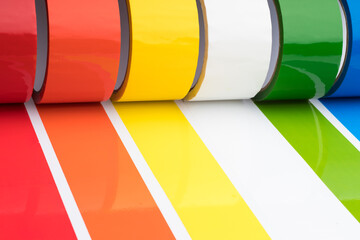 Colored adhesive tape rolls. Stripes of colored tape pasted side by side