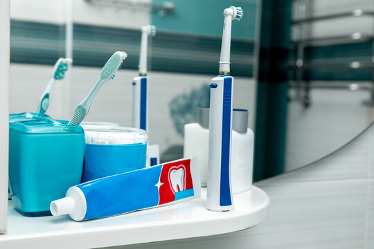 Oral hygiene kit on a white shelf. Side view