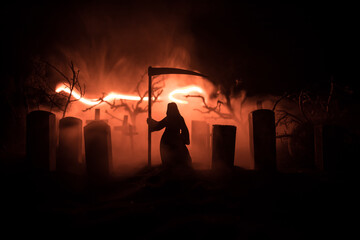 Scary view of zombies at cemetery dead tree, moon, church and spooky cloudy sky with fog, Horror...