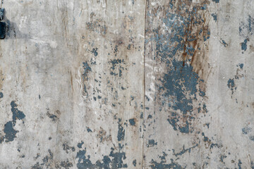 Peeling black paint on old fabric.