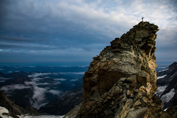 Fototapeta na wymiar Summit cross on a swiss mountain
