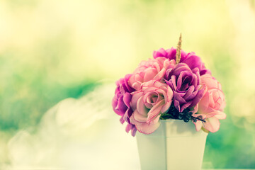 Vintage bouquet roses on blur green tree background