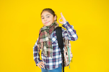 funny child school girl girl on a yellow background