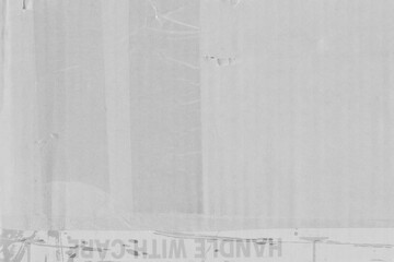 White vintage rough sheet of carton. Recycled environmentally friendly cardboard paper texture. Simple gray minimalist papercraft background.