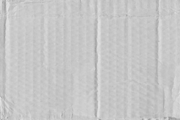 White vintage rough sheet of carton. Recycled environmentally friendly cardboard paper texture. Simple gray minimalist papercraft background.