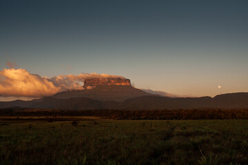 View with the moon of the Ptari Tepui plateau at sunset on the way to the Karuay waterfall La Gran Sabana Venezuela