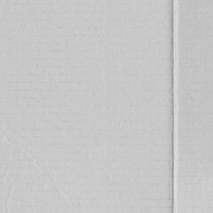 White vintage rough sheet of carton. Recycled environmentally friendly cardboard paper texture. Simple gray minimalist papercraft background.