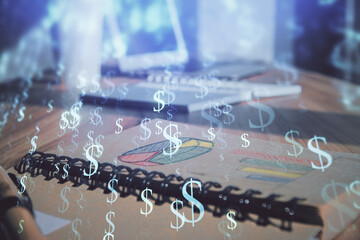 Double exposure of financial graph drawings and desk with open notebook background. Concept of forex market