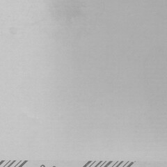 White vintage rough sheet of carton. Recycled environmentally friendly cardboard paper texture. Simple gray minimalist papercraft background.