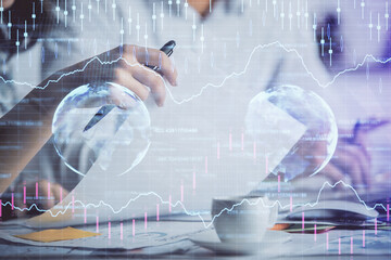 Double exposure of forex graph drawing over people taking notes background. Concept of financial analysis