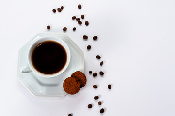 Hexagonal coffee cups with coffee beans on white background. With space for text. View from the top