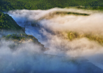 fog in the canyon. Autumn morning in the Dniester river valley