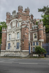 Fototapeta premium Le Havre Gadelles castle - Villa des Gadelles built around 1880s. Chateau des Gadelles also known as Porte de Burgos replica XIV century Arco de Santa Maria castle in Burgos, Spain. Le Havre, France.