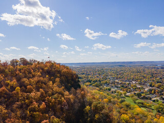 autumn landscape of the bluffs in lacrosse, Wisconsin with trees and clouds over granddads bluff...
