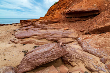 At Cavendish beach, on Canada's Prince Edward Island, the red sandstone weathered with yellow sand created a stunning pattern from eons of erosion against the cliff.
