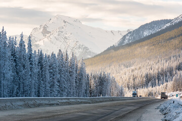 CANADA - DECEMBER 12 2017: Trucks passing through the Trans Canada Highway between Calgary and Banff.