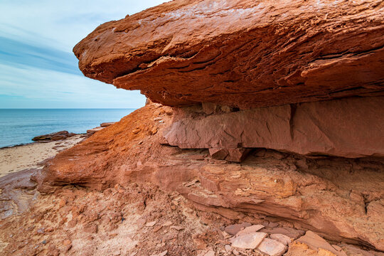 At Cavendish beach, on Canada's Prince Edward Island, the red sandstone weathered with yellow sand created a stunning pattern from eons of erosion against the cliff.