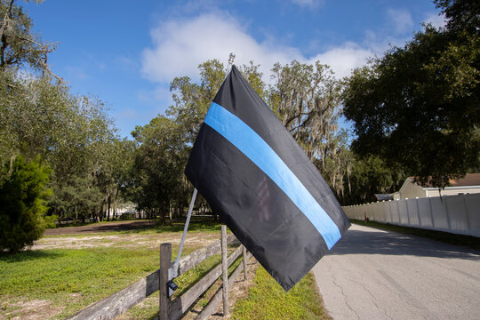 Blue Lives Matter Flag Aka Police Thin Blue Line Flag, Waving In The Breeze In Support Of Police.