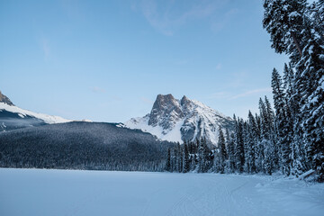 View of a frozen Emerald Lake and its surrounding mountains. British Columbia, Canada.