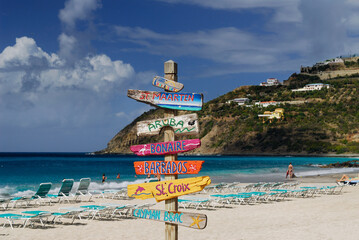 Signpost of Caribbean islands on the beach at St Maarten - obrazy, fototapety, plakaty