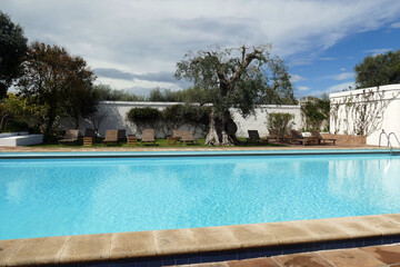Outside infinity swimming pool in a luxury villa