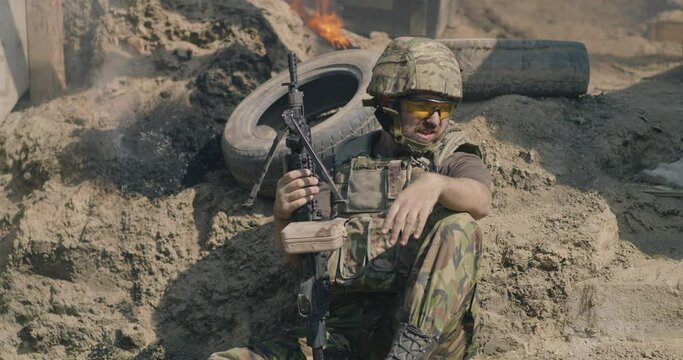 Male warrior resting during battle