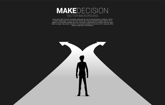 Silhouette of businessman standing at crossroad. Concept of time to make decision in business direction