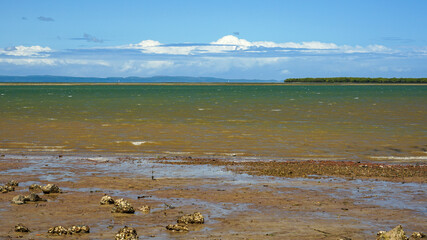 Peaceful sea view from Wellington Point, across the bay to Stradbroke Island with a beautiful cloudscape on the horizon.