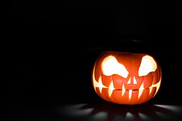 halloween pumpkin glowing homemade carved pumpkin with shadows