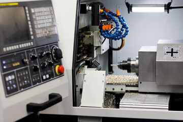 CNC metal lathe machine working with brass bar
