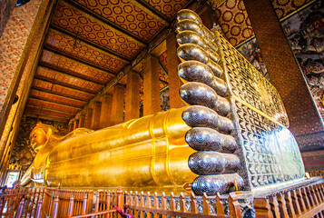 The Big Reclining Buddha statue in Wat Pho Temple, an Asian style Buddha Art, open to worship. Wat...