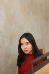 Fototapeta premium Young beautiful woman wearing red casual t-shirt.