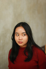 Fototapeta premium Young beautiful woman wearing red casual t-shirt.