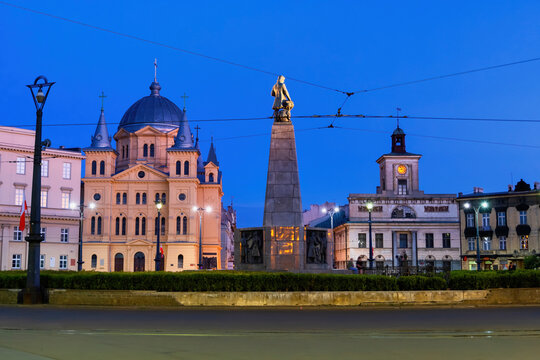 Poland, Lodz, Power lines over Freedom Square with Church of Pentecost of Holy Spirit, Kosciuszko Monument and town hall in background