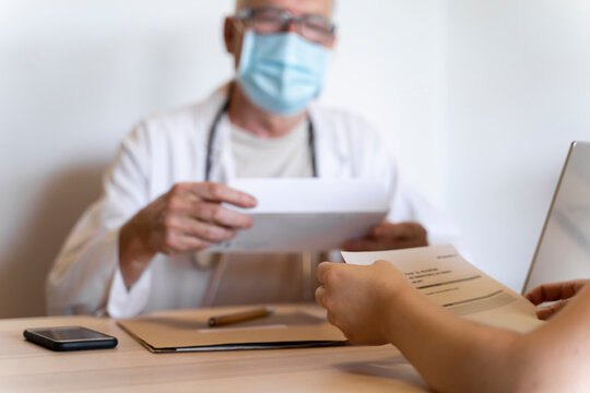 Doctor giving medical reports to patient