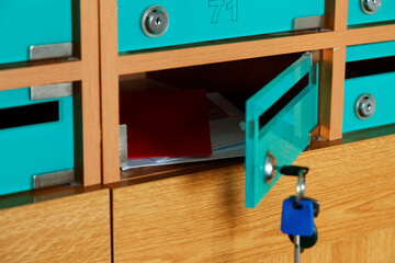 Letters and envelops in open postbox in post