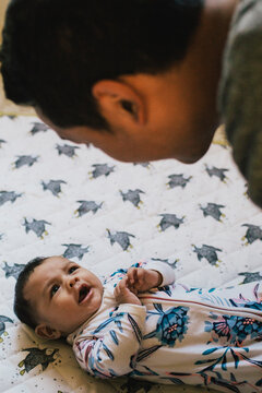 A father looks at his baby