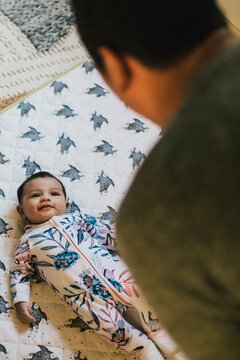 A father looks at his baby