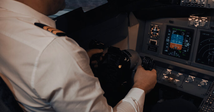 Pilot operating airplane with helm