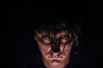 portrait of a man in low light moody