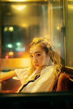 portrait of young asian woman on the street at night