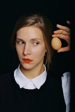 Portrait of a girl with an egg