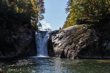 Fototapeta na wymiar Waterfalls cascades over a rock cliff, Elk River Falls, NC