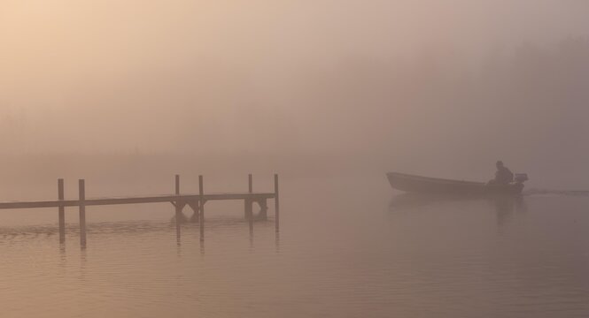 Dock and boat in the fog on Lake Staffelsee with the island of Woerth near Seehausen, Murnau, Upper Bavaria, Bavaria, Germany, Europe, PublicGround, Europe